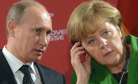 Merkel warns Russia of more Ukraine sanctions