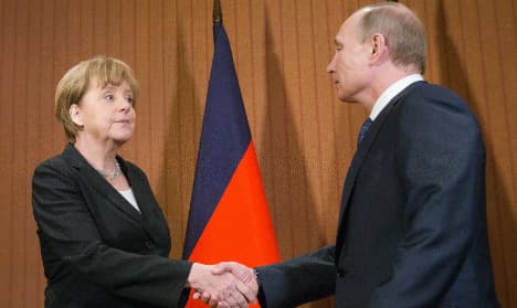 Merkel, Putin agree on international crash probe