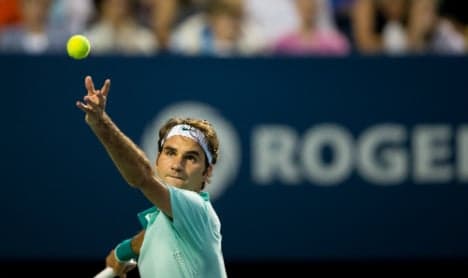 Federer cruises past Lopez to book final spot