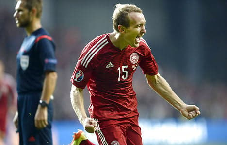 Denmark rides header to victory over Armenia