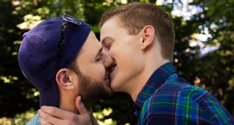 Men face charges over 'passionate' public kiss