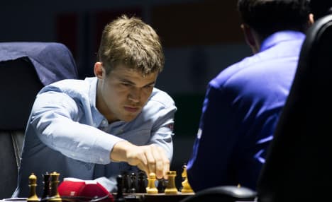 World Chess Champs: Carlsen loses first game