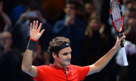 Federer survives thriller to earn Djokovic clash