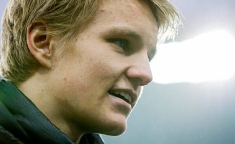 Martin Odegaard trains with Liverpool