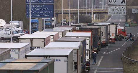 Truckers lift roadblock near Paris