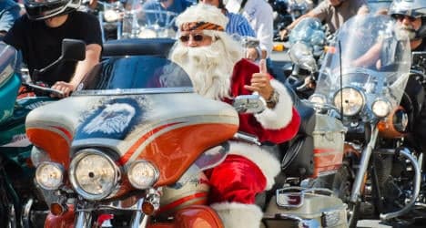 Santa bikers ride through Paris for orphans