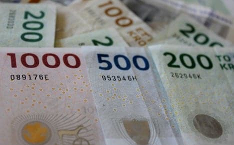 Danish central bank cuts rate as euro weakens