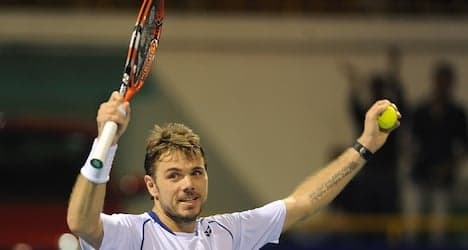Wawrinka starts title defence with victory