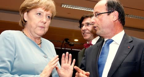 Hollande and Merkel to join Davos forum leaders