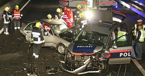 Wrong way driver crashes with police car