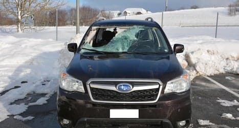 Woman injured as chunk of snow drops on car