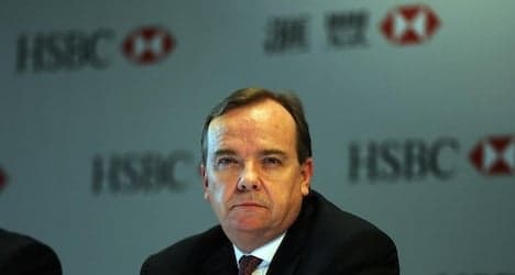 HSBC boss backs Swiss account as profits slip
