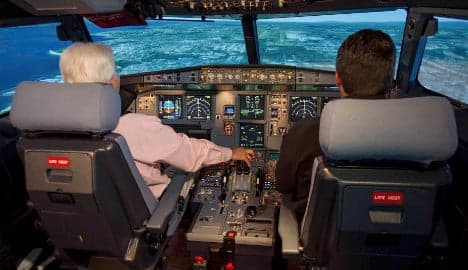 Airlines agree two-person cockpit rule