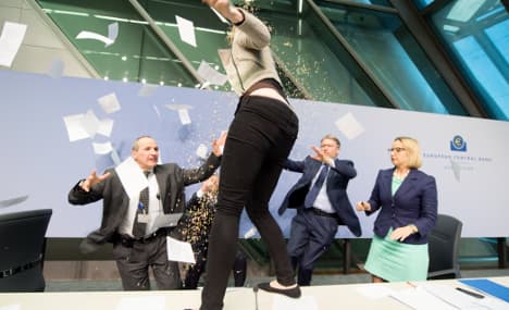 Mario Draghi suffers anti-ECB confetti attack
