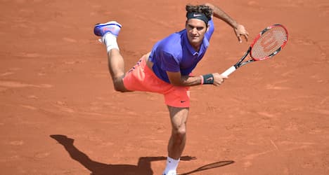 Federer and Wawrinka advance in French Open