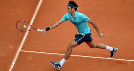 Federer fends off feisty Anderson in Rome