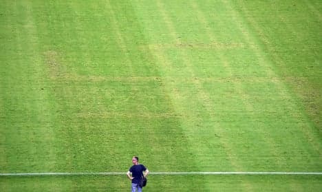 Italy complain after swastika etched on pitch