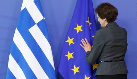 Economists warn against going easy on Greece