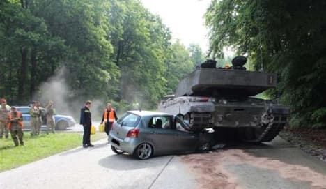 British army tank crushes learner's car