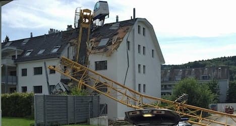 Crane collapses on apartment building