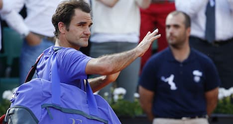 Federer preps for Wimbledon in Germany