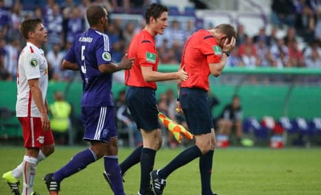 Attack on referee halts football match
