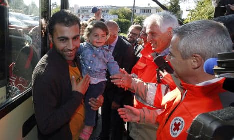 IN PICS: Refugees arrive for new life in France