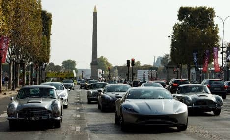 Iconic James Bond cars parade through Paris