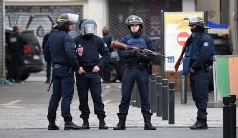 Woman blows herself up in Paris police raid