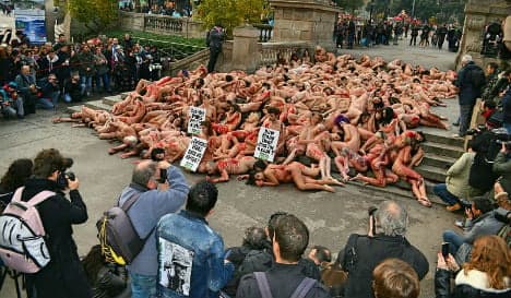 In pics: Protesters strip for 'blood-soaked' anti-leather demo in Spain