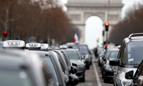 French taxi blockades lifted as Valls vows Uber crackdown