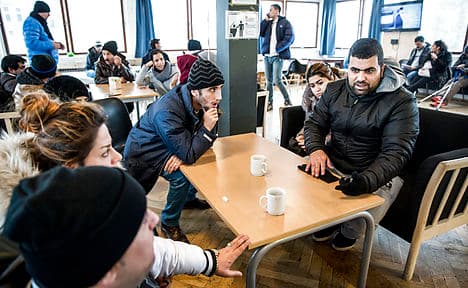 Danish MPs mull plan to take refugees' cash