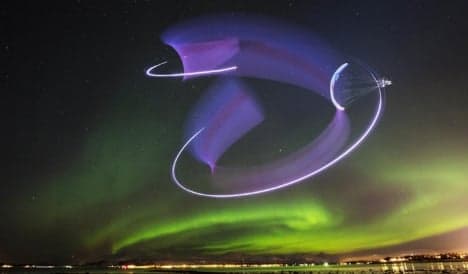 Spanish paraglider dances in the sky with Northern Lights