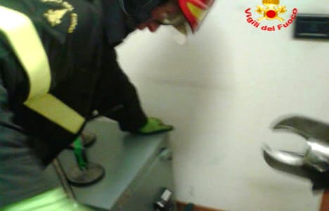 Italian firemen rescue child locked in bank safe