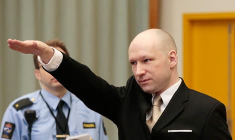 Breivik makes Nazi salute as civil trial begins