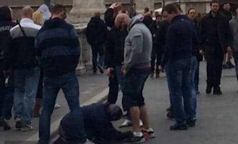 Prague football fans filmed urinating on Rome beggar
