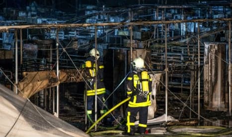 Dozens saved as huge refugee home burns to ground