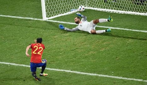 Spain wins place in knockout round after routing Turkey 3-0