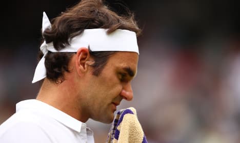 I'll be back at Wimbledon, vows beaten Federer