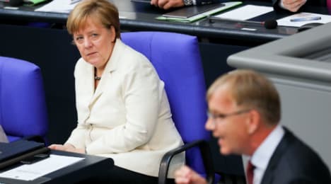 Brexit, budget keep Merkel away from football