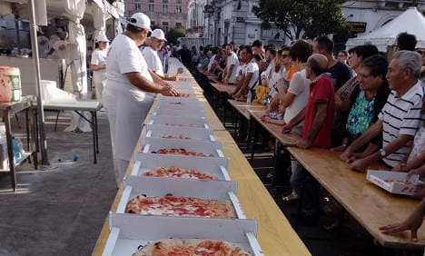 It's a record! Italian chefs make 5,836 pizzas in 12 hours