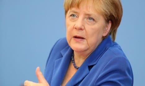 Merkel rallies German industry to take tough line on Brexit