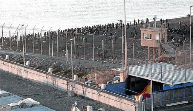 Nearly 400 migrants storm border at Spanish enclave of Ceuta