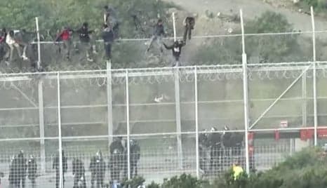 1,100 migrants storm border fence at Spain's Ceuta enclave