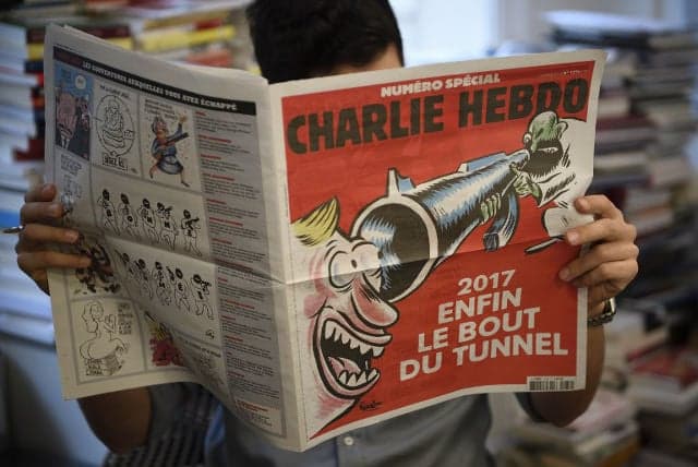 Charlie Hebdo marks attack anniversary with black humour