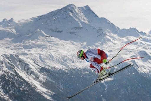 Swiss skier Feuz takes gold on home soil