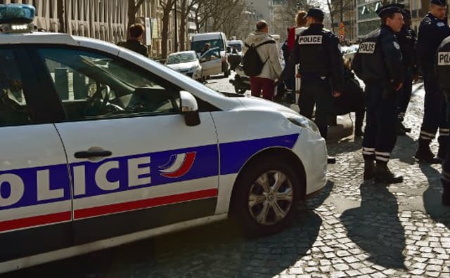 Man held after his father and brother found with throats slit in Paris