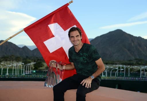 Federer triumphs over Wawrinka in all-Swiss final