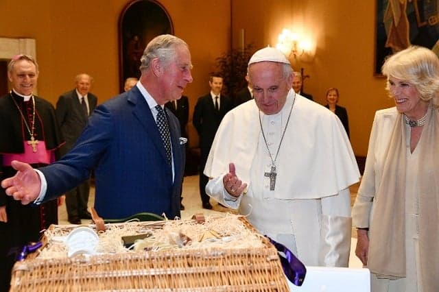 Prince Charles and Camilla swap gifts with the pope