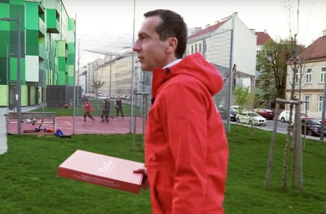 VIDEO: Austria's chancellor delivers pizzas... but critics aren't buying it